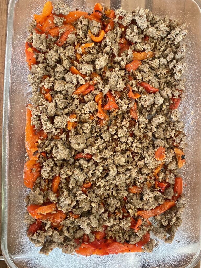 Browned sausage and roasted red peppers ready for the egg white/cottage cheese mixture.